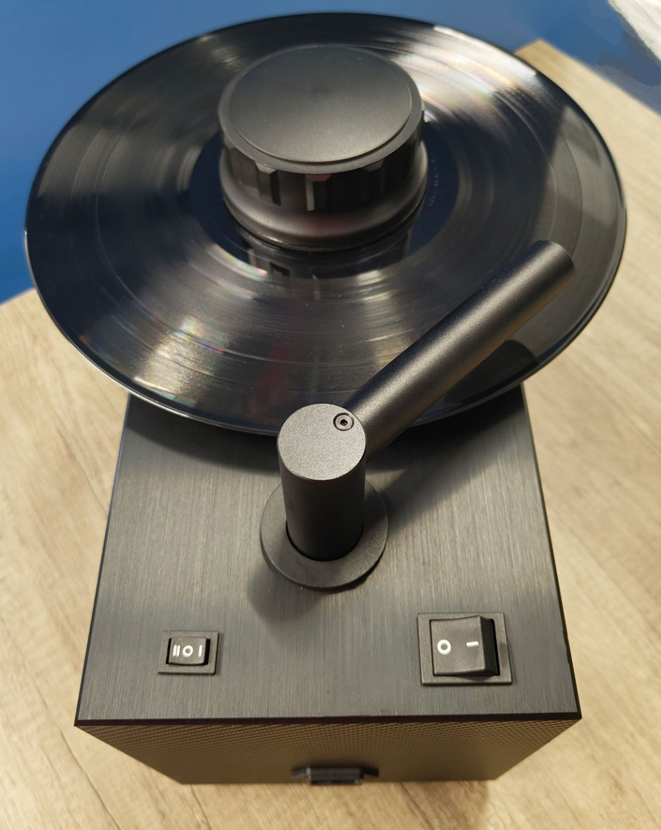 Record Doctor X dual-sided vinyl record cleaning machine showing overhead vacuum arm and record spindle
