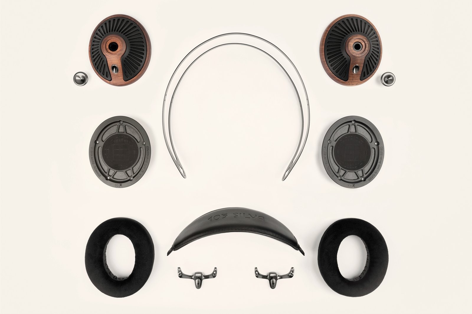 Meze Audio 105 SILVA serviceable parts Meze Audio 105 SILVA taken apart, with walnut ear cups, drivers, headband, ear pads and hardware laid out