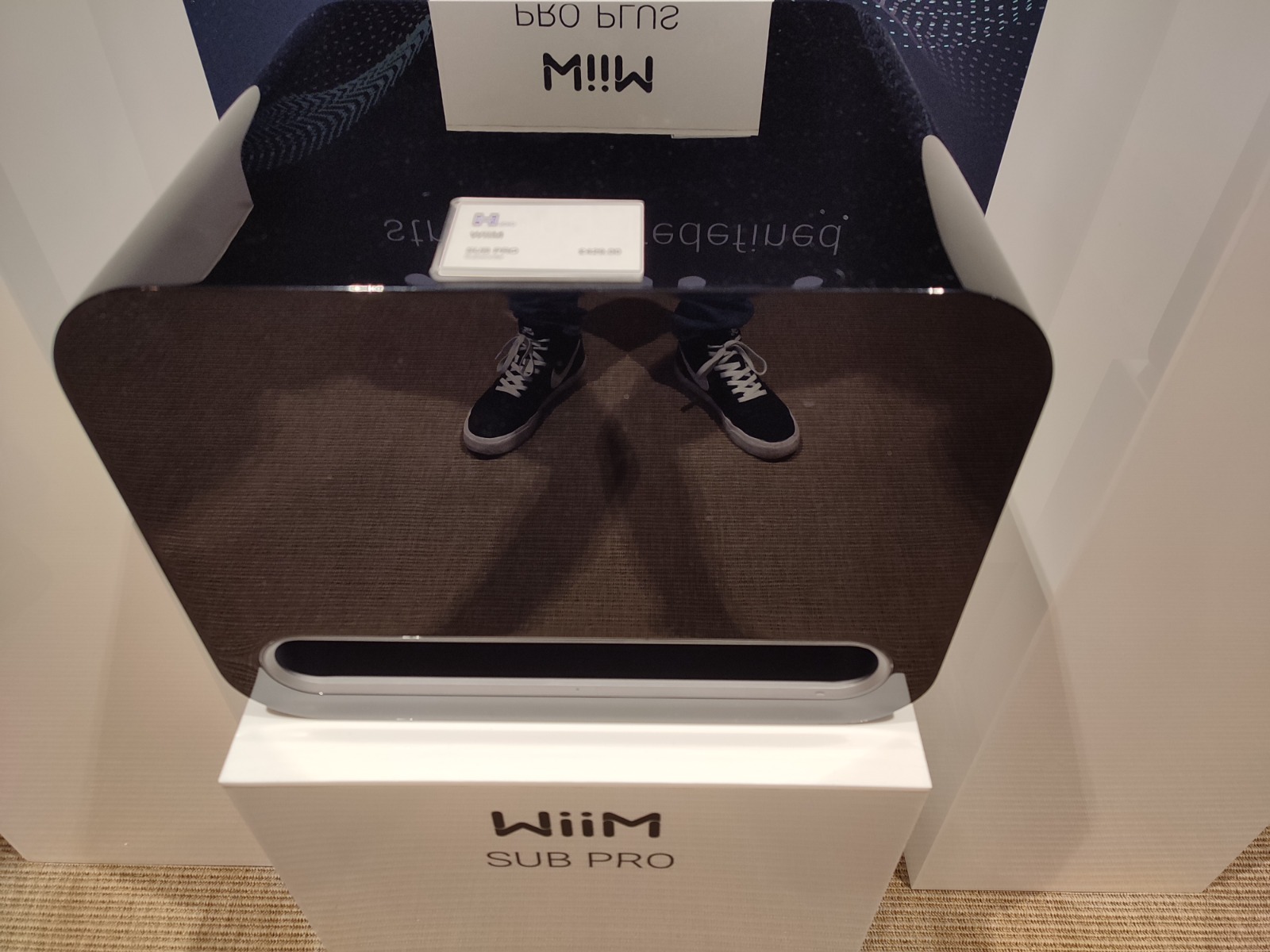 WiiM Sub Pro wireless subwoofer shown at Ascot press event