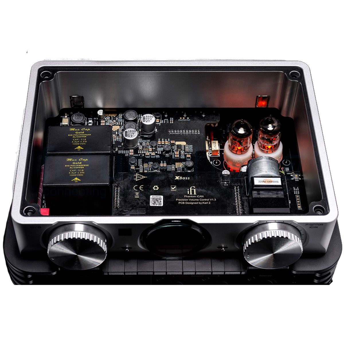 iFi iCAN Phantom showing transparent lid, glowing GE5670 tubes, and front panel controls including XBass and XSpace